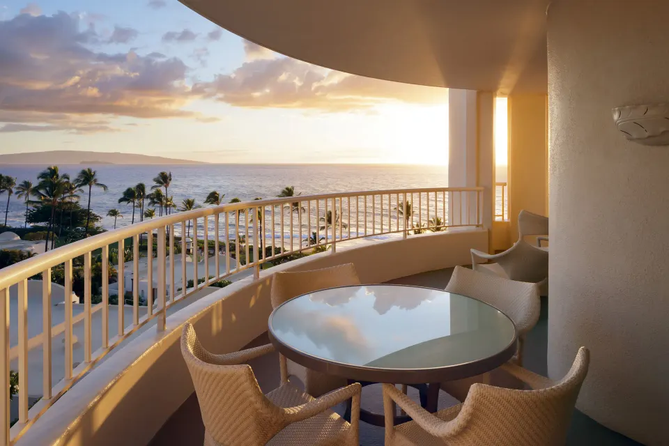Kilohana Corner Suite balcony with ocean sunset at Fairmont Kea Lani Maui.