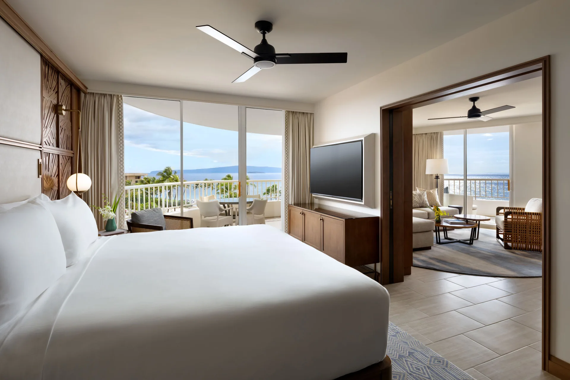 Kilohana Corner Suite king bedroom and sitting area at Fairmont Kea Lani Maui.