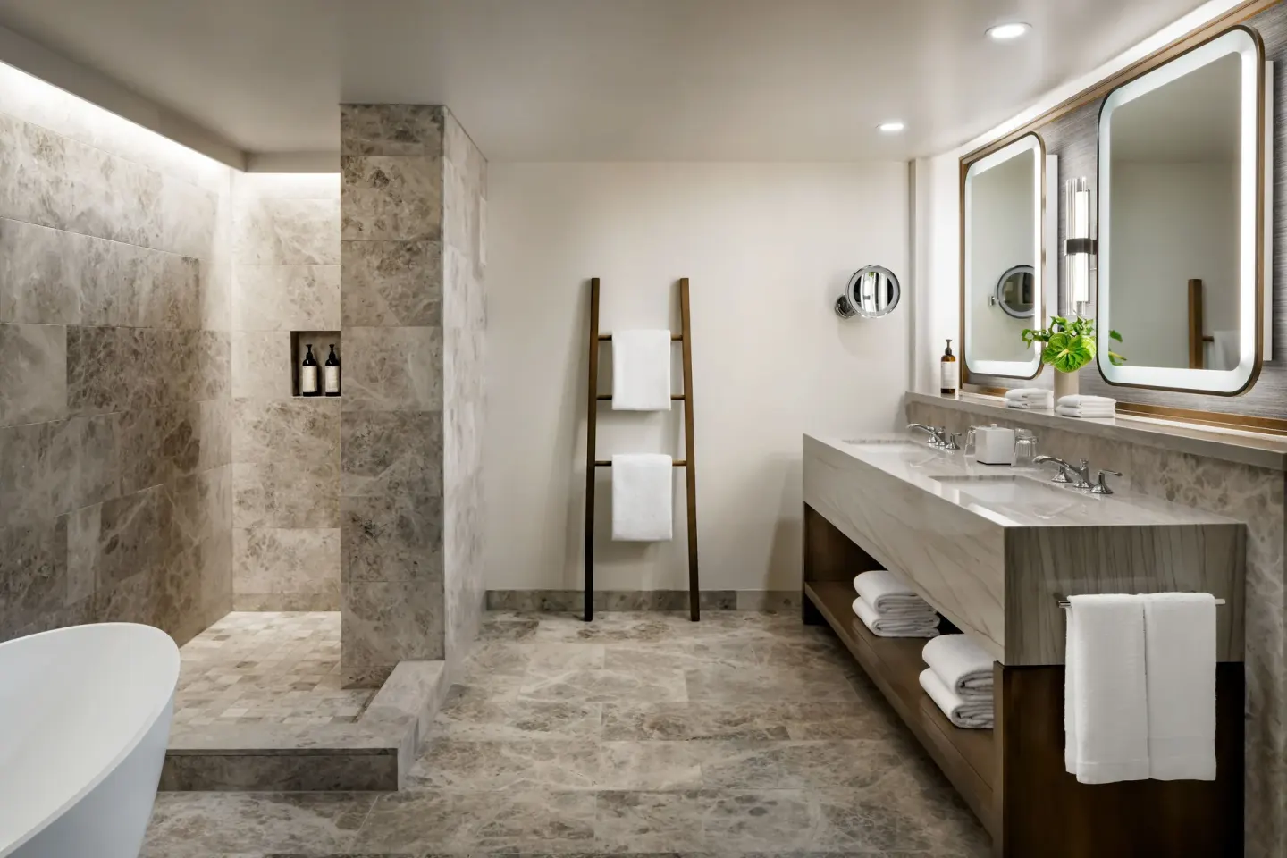 Luxury villa bathroom at Fairmont Kea Lani Maui with marble shower, soaking tub, and double vanity.