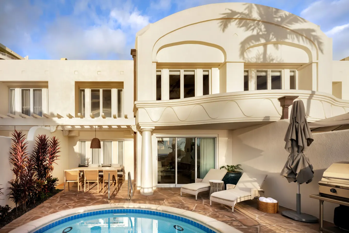 Exterior of a luxury villa at Fairmont Kea Lani Maui with private pool, terrace seating, and balcony.