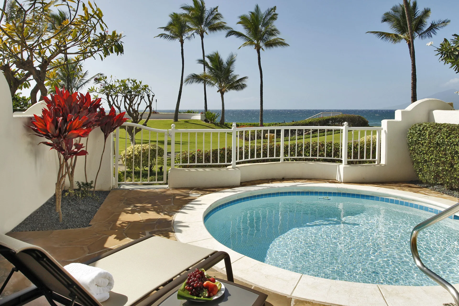 Oceanfront villa plunge pool and palm-framed ocean view at Fairmont Kea Lani Maui.