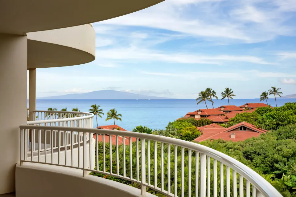 Partial Ocean View Suite balcony with ocean and red-roof views at Fairmont Kea Lani Maui.