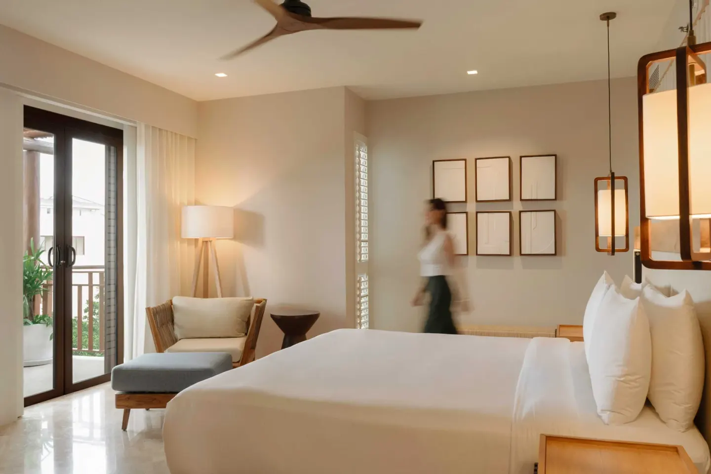 Bambu Suite bedroom with king bed and balcony doors at Fairmont Mayakoba.