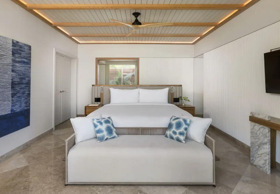 King bed and sofa in a Beach Area Casita Suite at Fairmont Mayakoba.