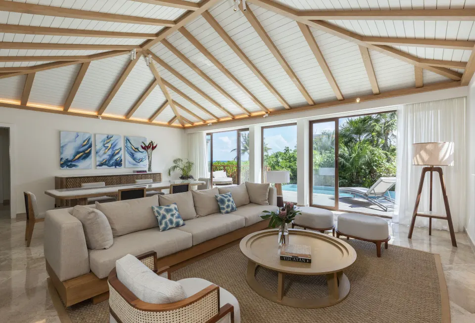 Beach Area Casita Suite living room at Fairmont Mayakoba with seating and private pool terrace.