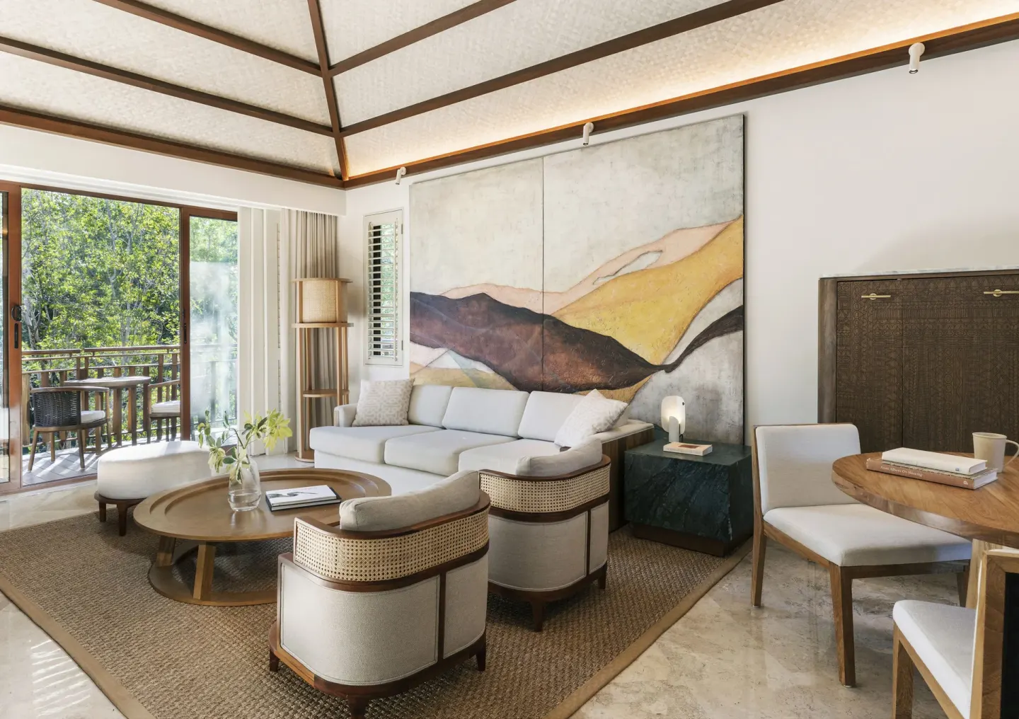 Casita Signature suite living room with sofa bed and balcony at Fairmont Mayakoba.