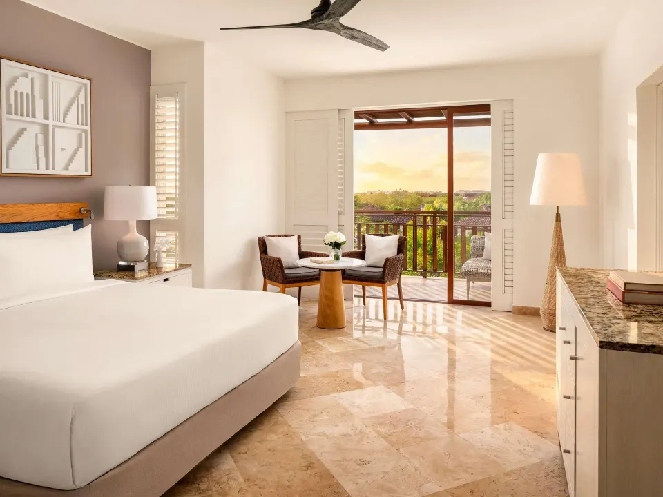 Family Room garden view with king bed and balcony at Fairmont Mayakoba.