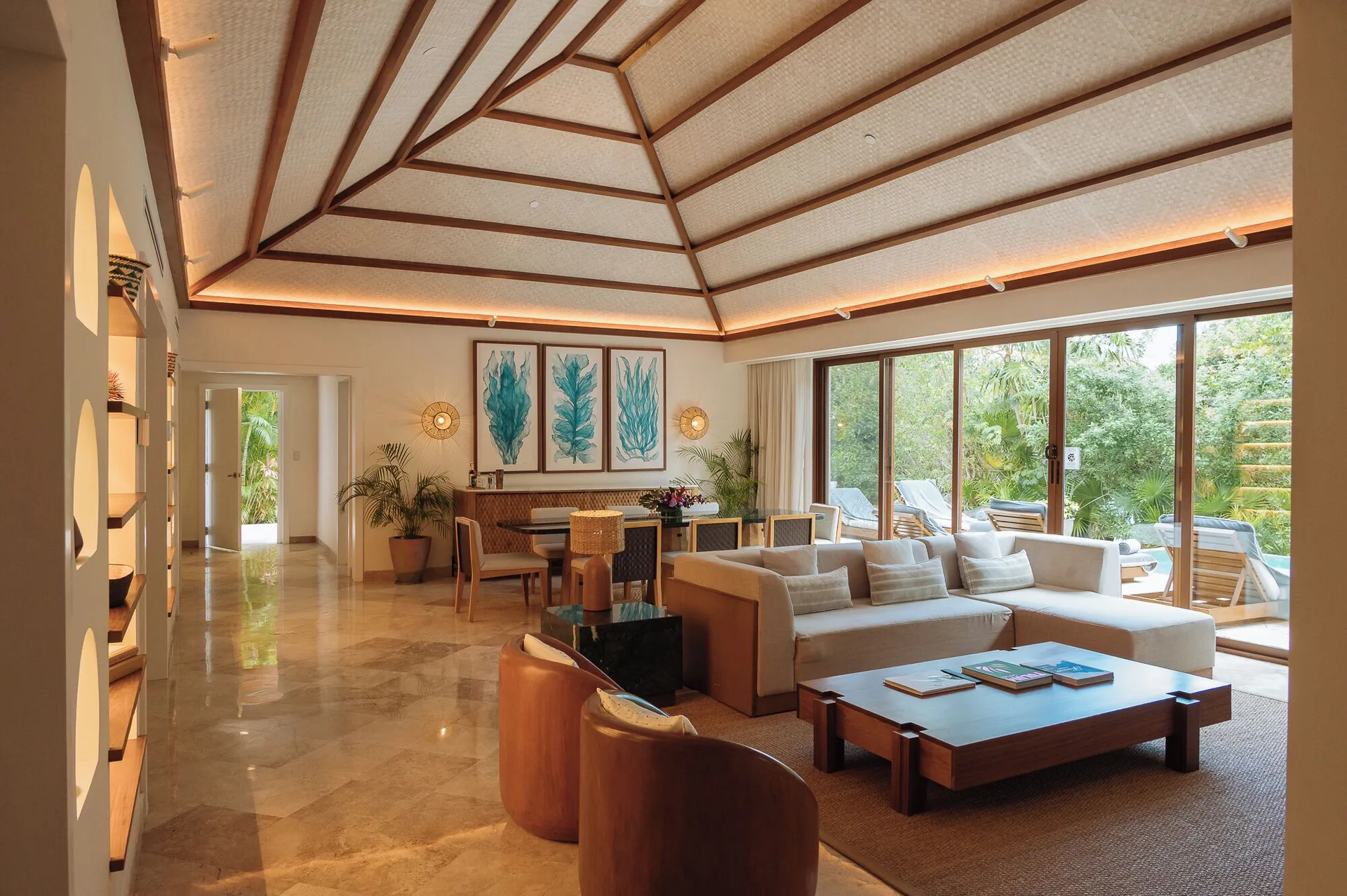 Living and dining area of La Tortuga Suite with pool terrace at Fairmont Mayakoba.