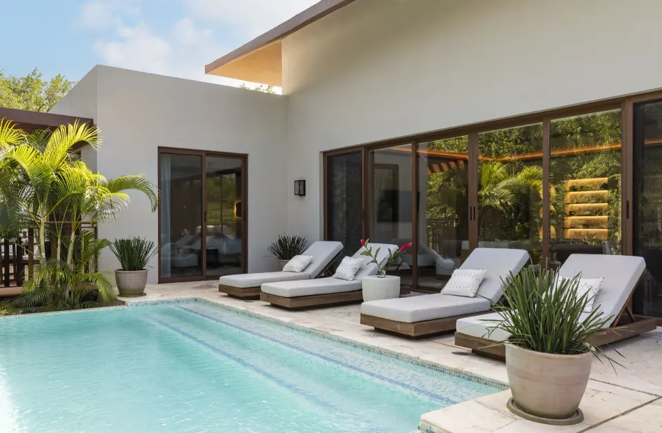 Presidential Suite Tortuga pool terrace with loungers and palms at Fairmont Mayakoba.