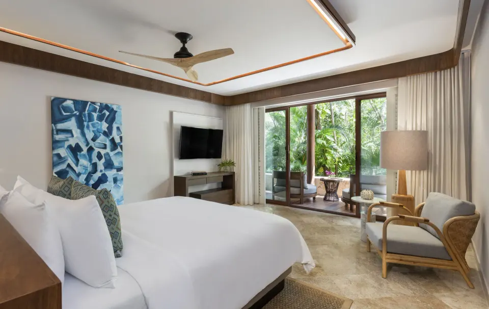 Suite Non Smoking Coral bedroom with king bed and terrace at Fairmont Mayakoba.
