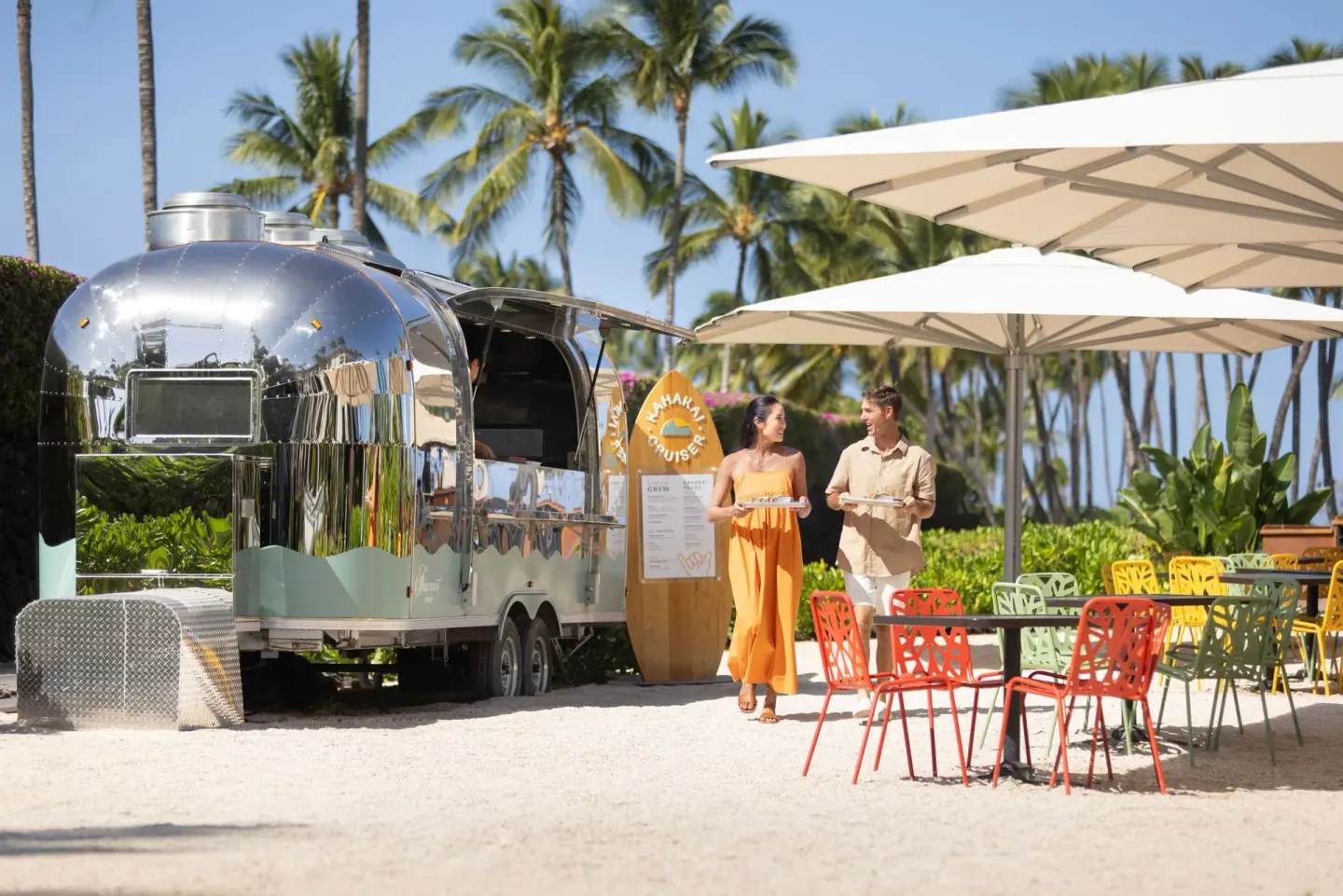 Kahakai Cruiser food trailer with colorful outdoor seating at Fairmont Orchid.