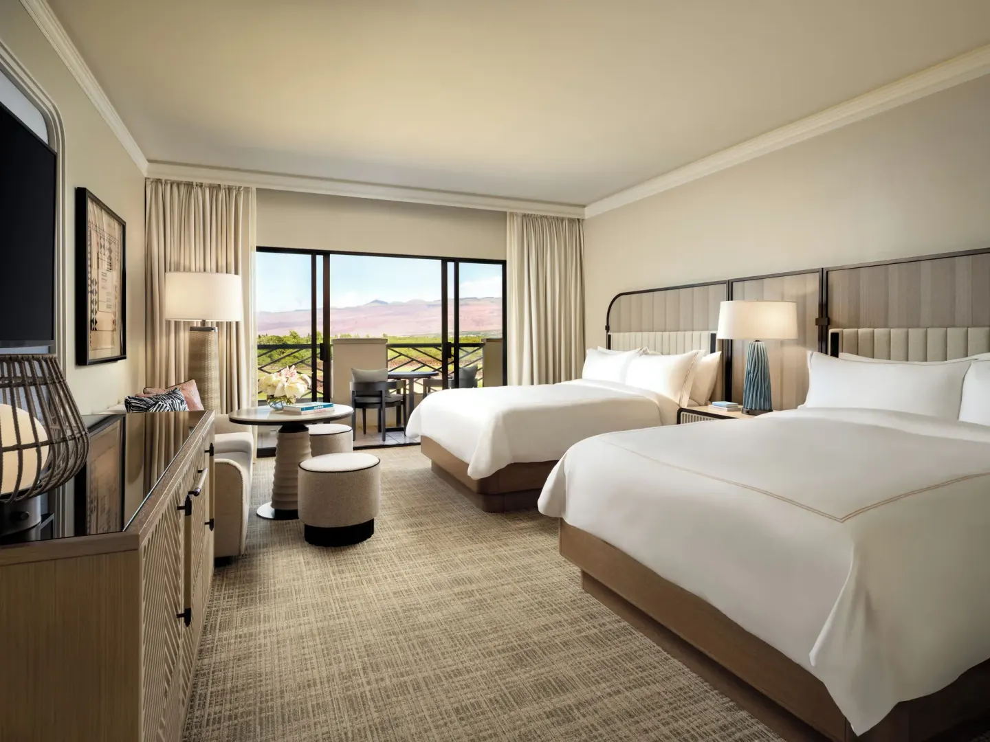 Premium ocean view room with two queen beds and balcony at Fairmont Orchid.