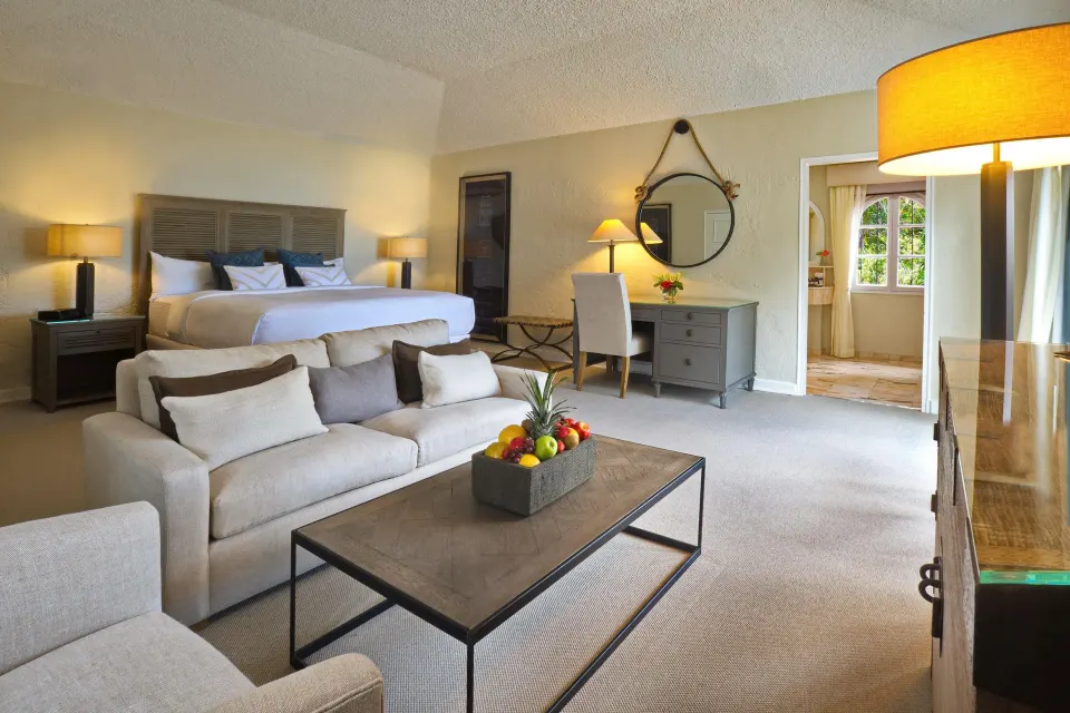 Junior Suite with king bed and sitting area at Fairmont Royal Pavilion.