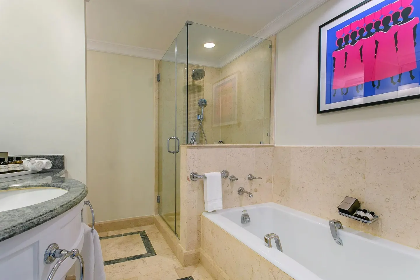 Luxury Room Oceanfront bathroom with tub and glass shower at Fairmont Royal Pavilion.