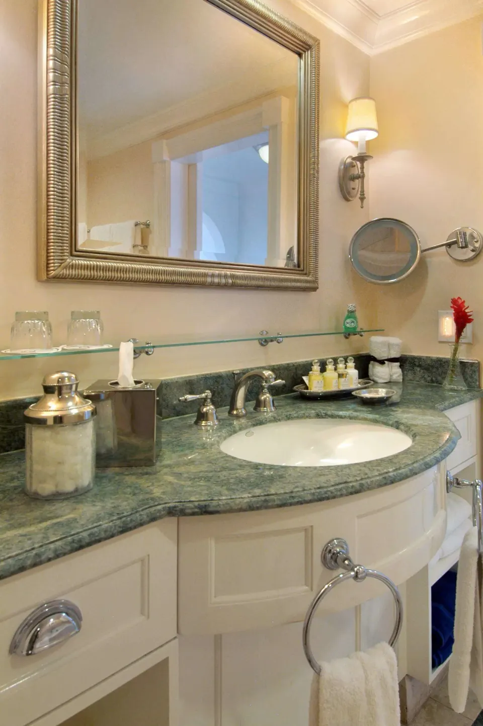 Luxury Room Oceanfront bathroom vanity at Fairmont Royal Pavilion with mirror, sink, and amenities.
