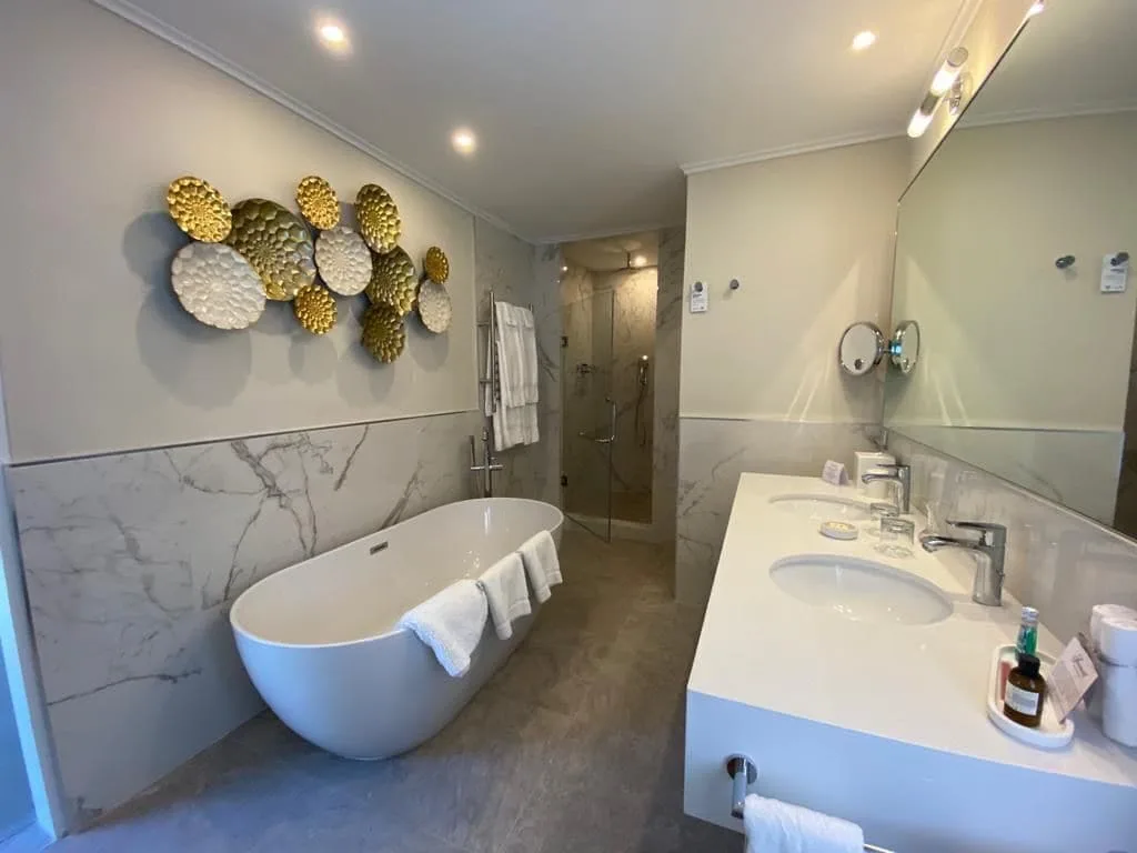 Two-bedroom suite bathroom with freestanding tub at Fairmont Royal Pavilion.