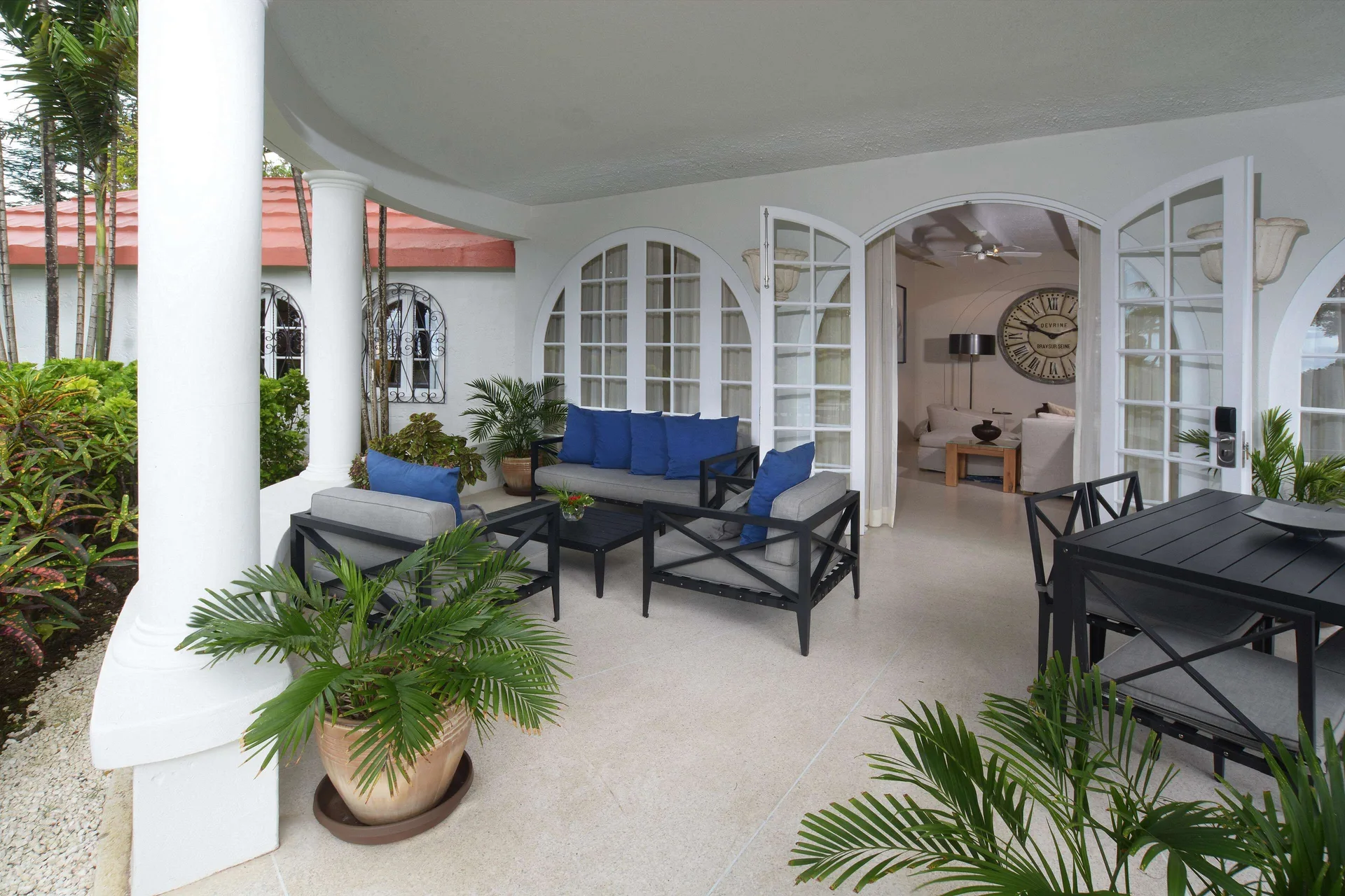 Two-bedroom suite terrace with seating and garden plants at Fairmont Royal Pavilion.