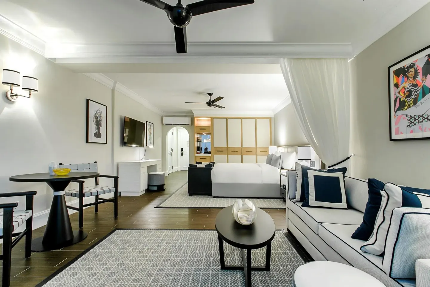 Accessible beachfront suite with bed and sitting area at Fairmont Royal Pavilion.