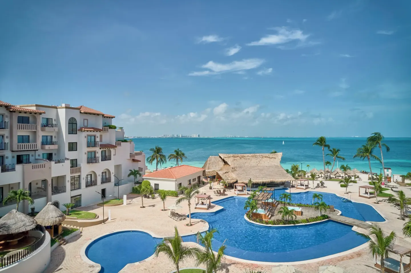 Resort pool complex and Caribbean Sea at Fiesta Americana Cancun Villas.