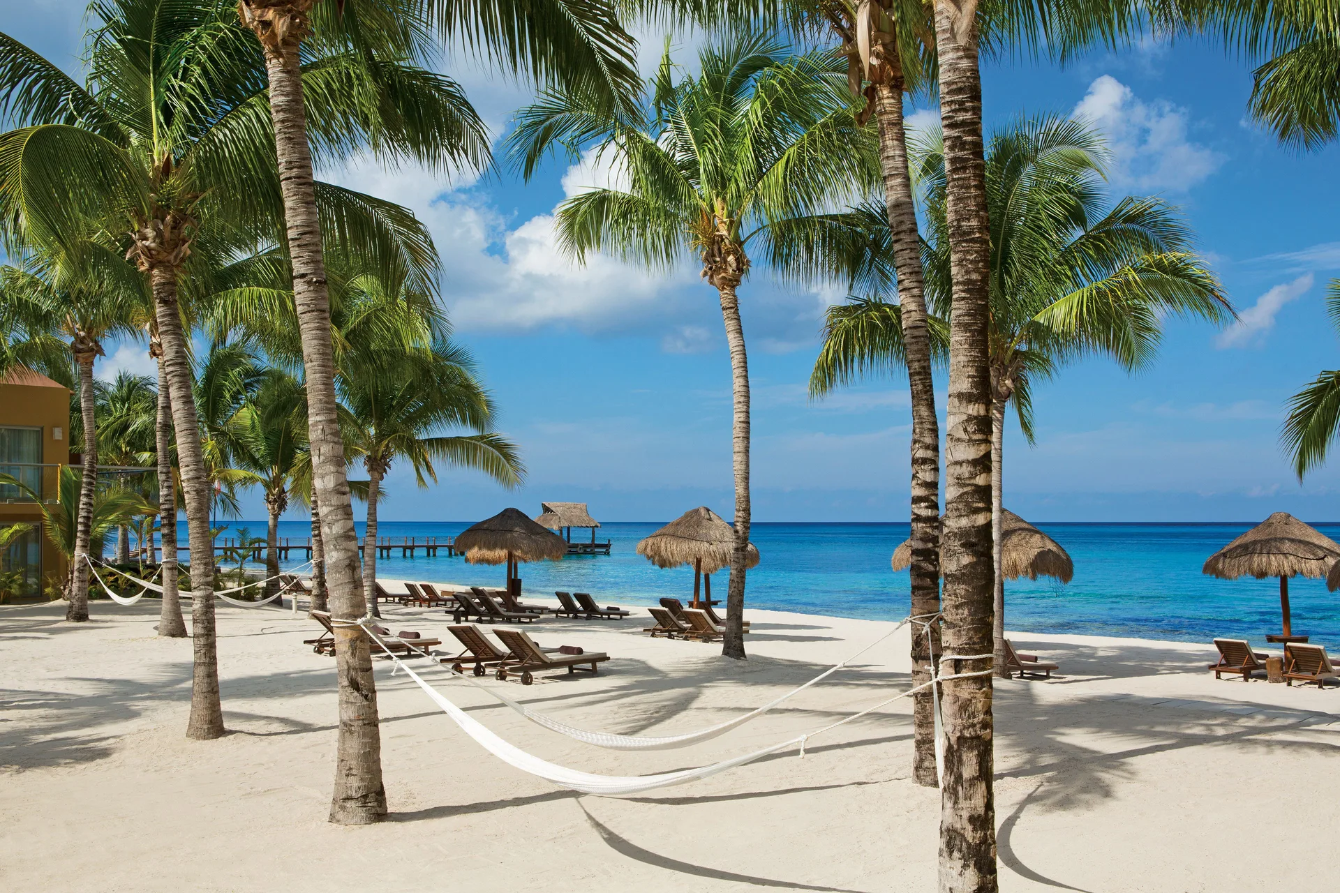 Secrets Aura Cozumel adults-only all-inclusive resort with beachfront pools and romantic island setting