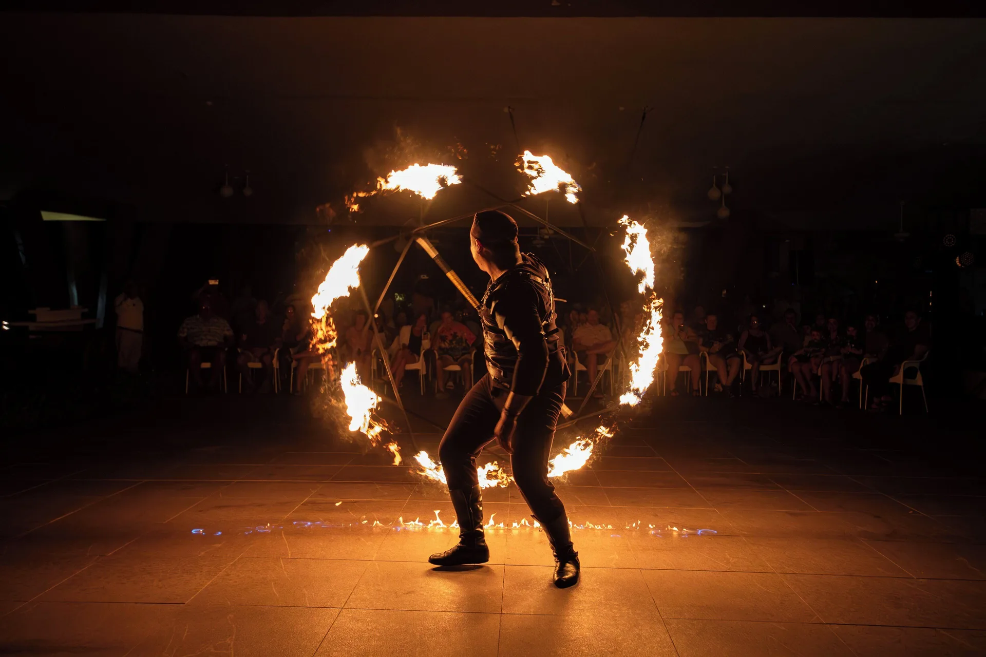 Night fire performer entertaining an audience at Fiesta Americana Cozumel.