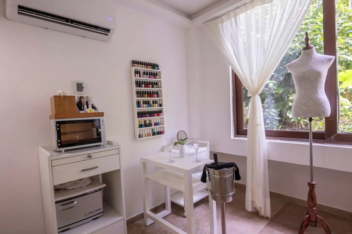Spa manicure area with nail colors and garden window at Fiesta Americana Cozumel.