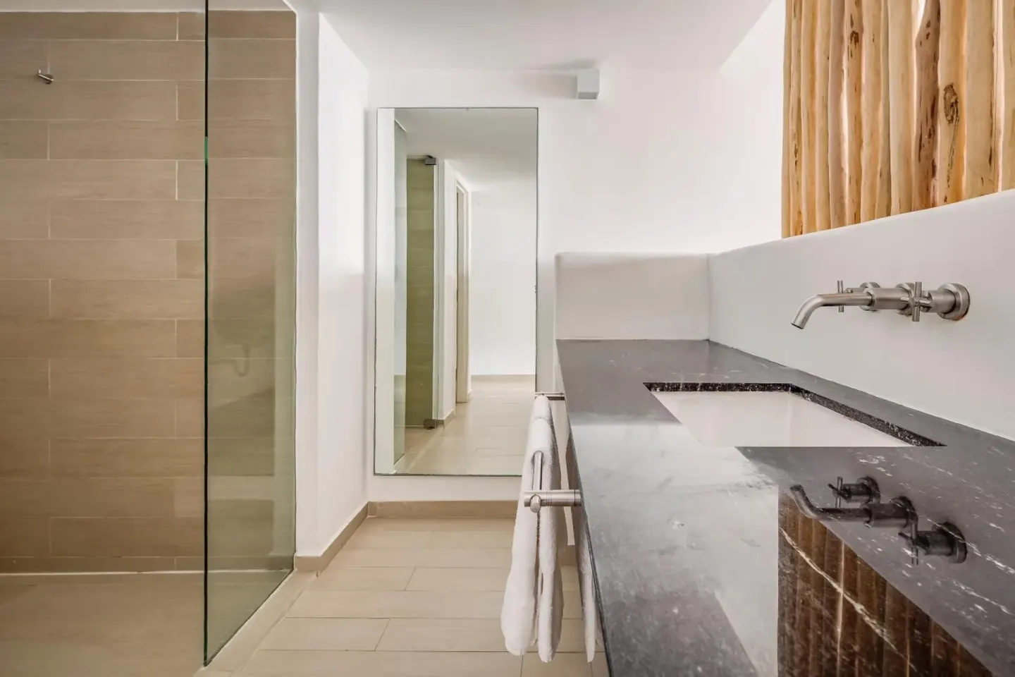 Deluxe Ocean View bathroom vanity and glass shower at Fiesta Americana Cozumel.