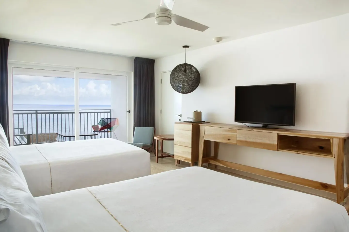 Deluxe Ocean View room with two beds and balcony at Fiesta Americana Cozumel.