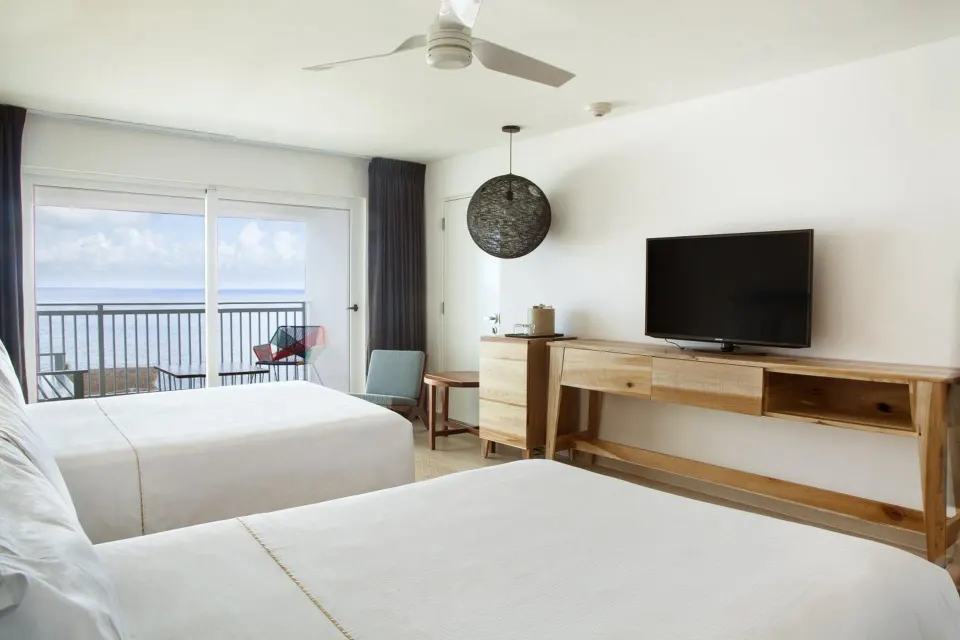 Deluxe Ocean View room with two beds and balcony at Fiesta Americana Cozumel.