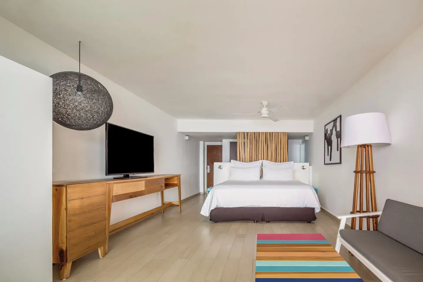 Deluxe ocean view room with king bed and lounge furniture at Fiesta Americana Cozumel.
