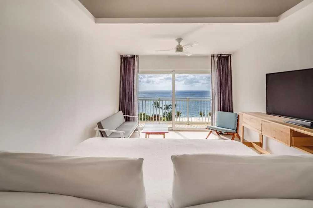 Deluxe Ocean View room with two beds and balcony at Fiesta Americana Cozumel
