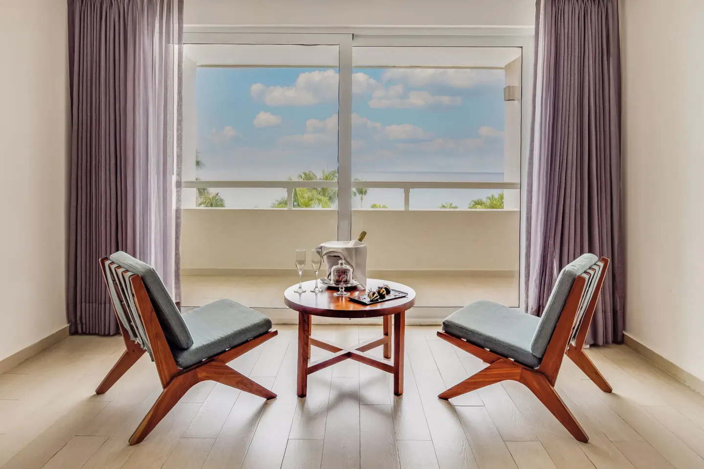 Honeymoon Suite sitting area with balcony view at Fiesta Americana Cozumel.