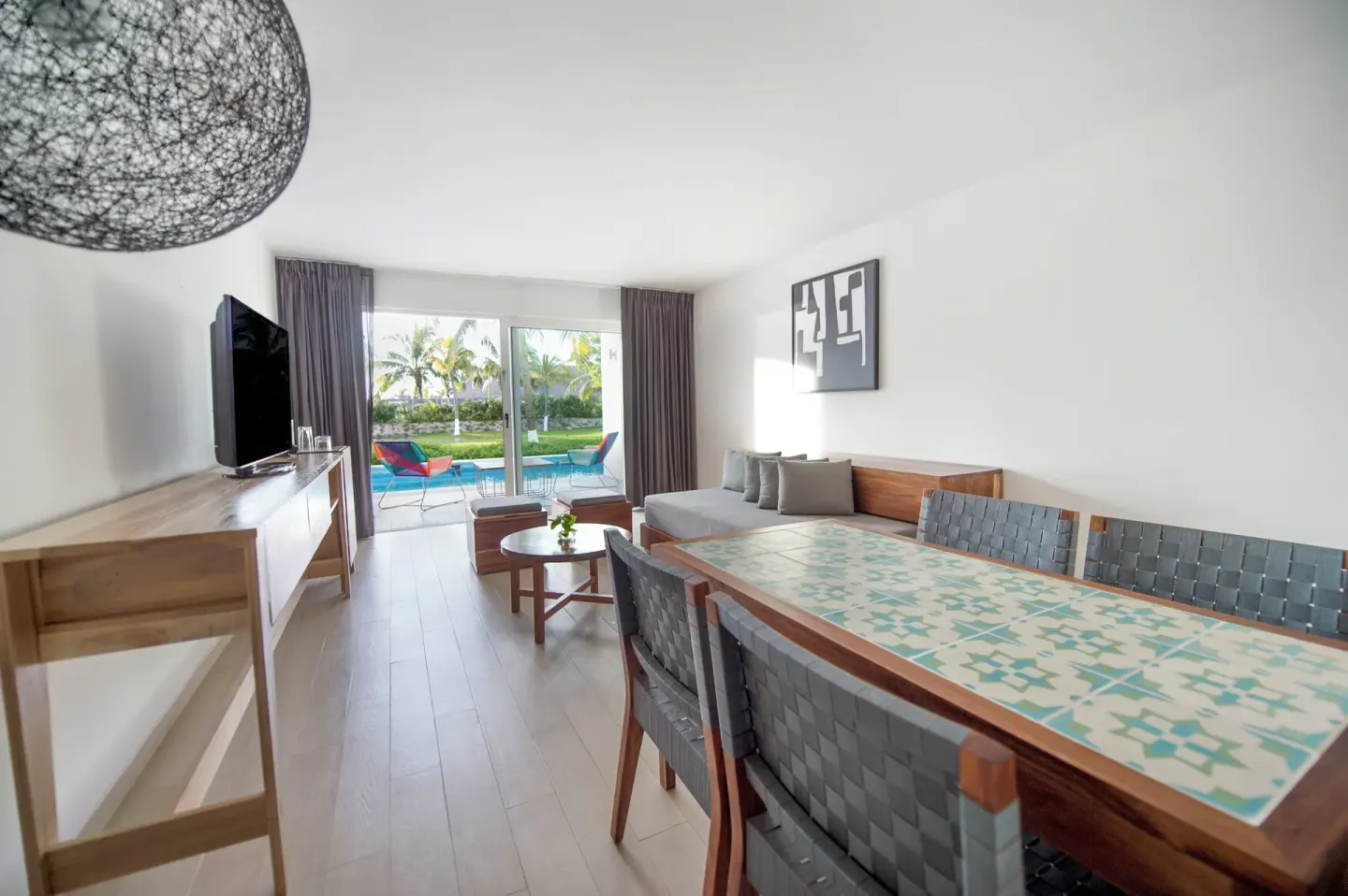 Master Suite dining table and lounge opening to a plunge pool at Fiesta Americana Cozumel.