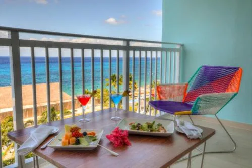 Master Suite balcony with ocean view and table setting at Fiesta Americana Cozumel.