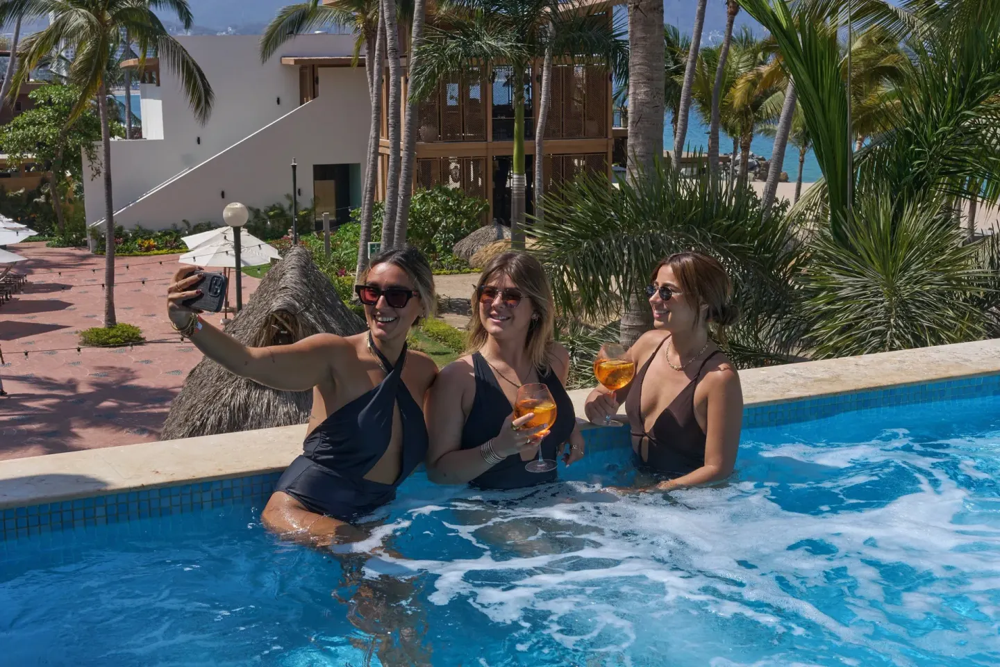 Guests take a selfie in a bubbling pool at Fiesta Americana Puerto Vallarta & Spa.