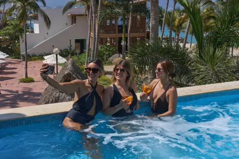 Guests take a selfie in a bubbling pool at Fiesta Americana Puerto Vallarta & Spa.