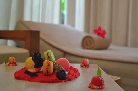 Spa treats on a table beside a lounge chair at Fiesta Americana Puerto Vallarta & Spa.