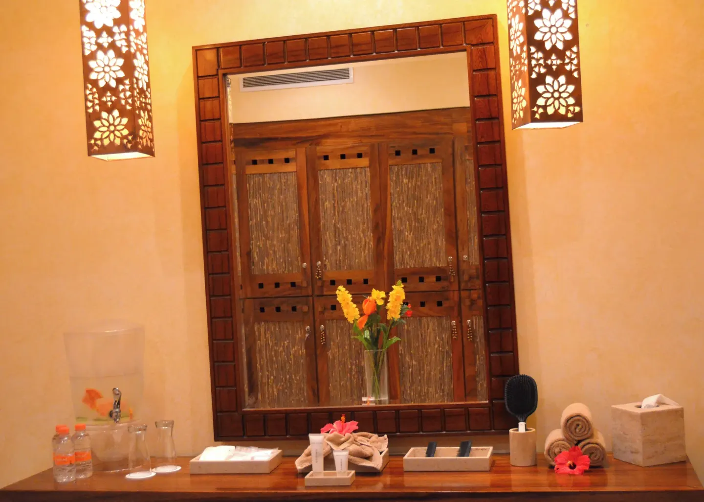 Spa vanity counter with mirror, towels, flowers, and amenities at Fiesta Americana Puerto Vallarta & Spa.