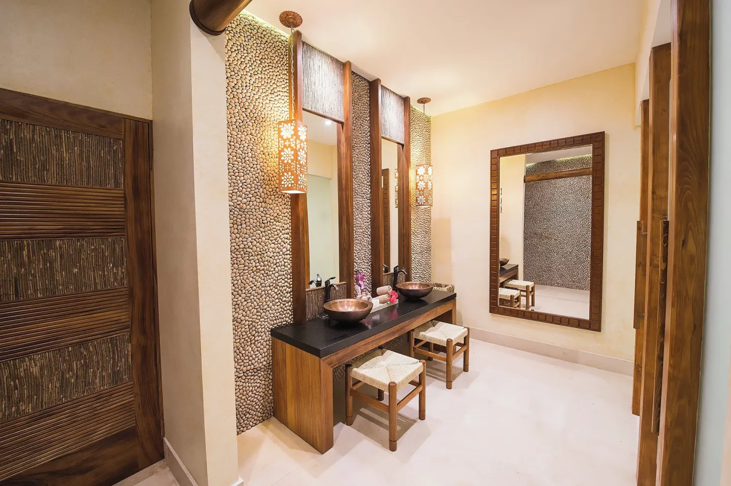 Spa vanity room with vessel sinks and stone accent walls at Fiesta Americana Puerto Vallarta & Spa.