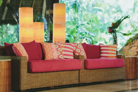 Wicker lobby sofas with bright red cushions at Fiesta Americana Puerto Vallarta & Spa.