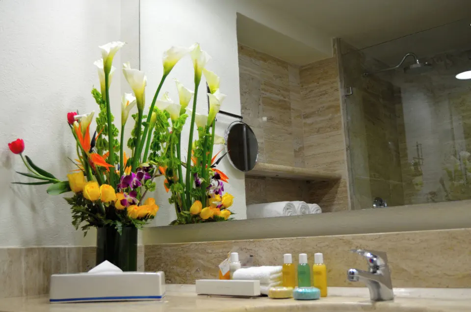 Family Room bathroom sink with flowers at Fiesta Americana Puerto Vallarta & Spa.