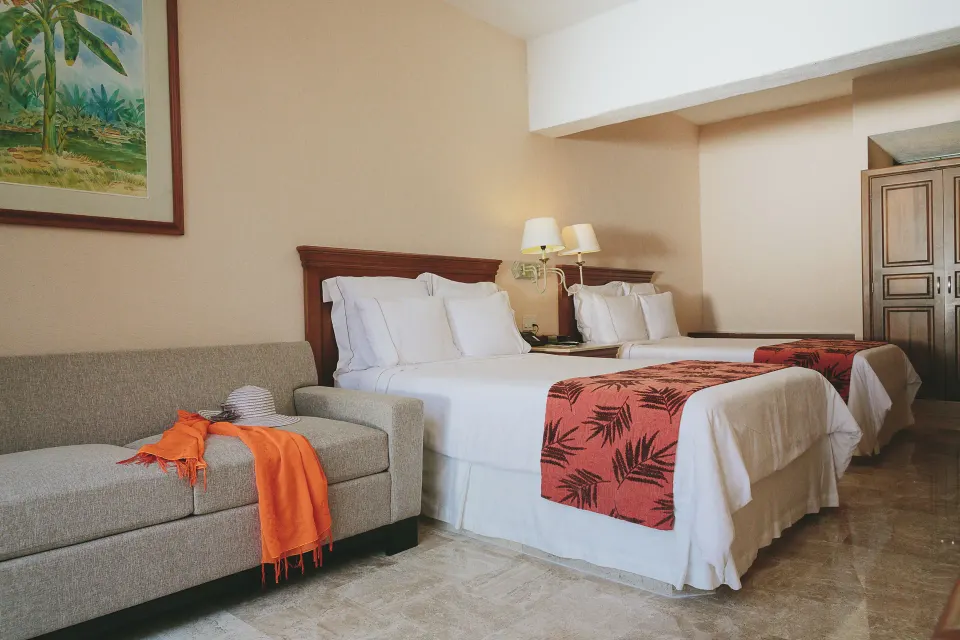 Family Room with two beds and sofa at Fiesta Americana Puerto Vallarta & Spa.