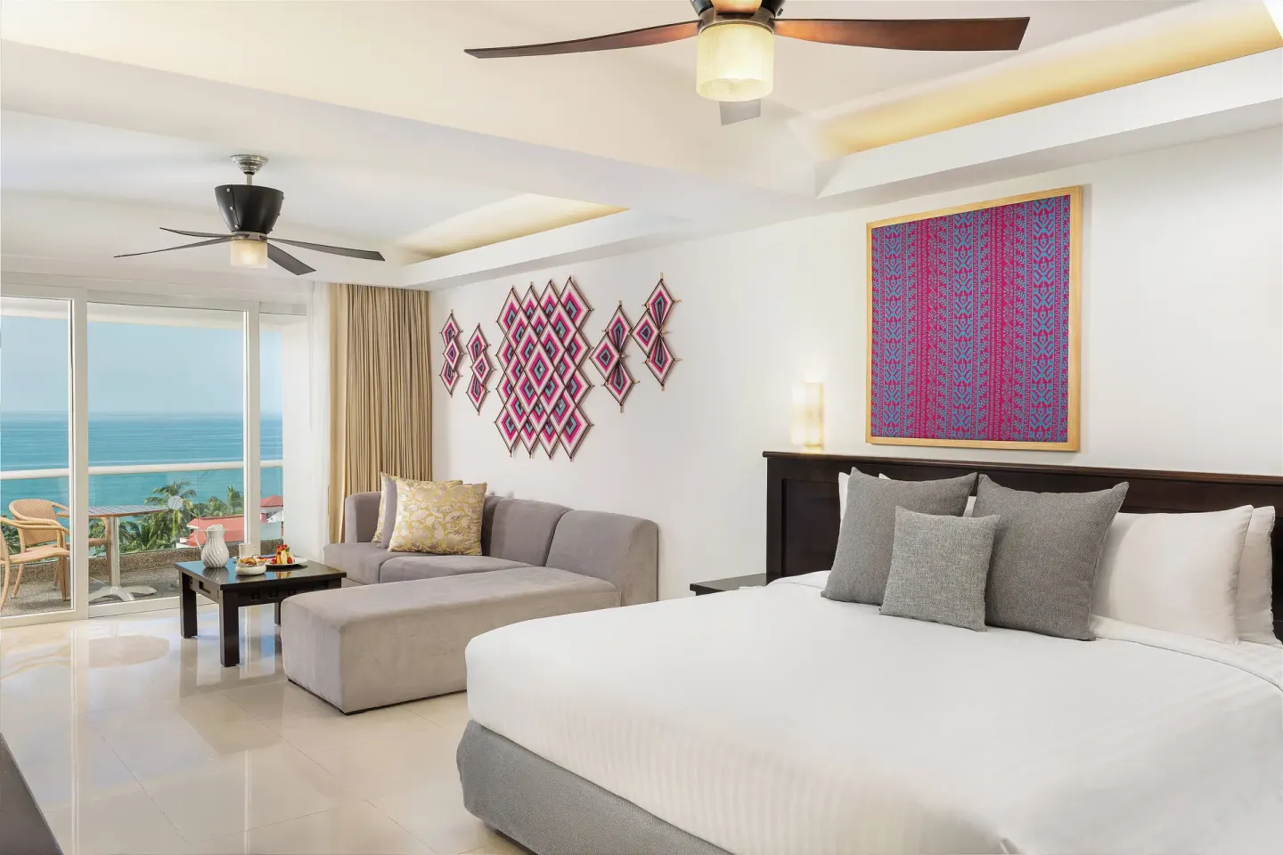King guest room with sofa and ocean-facing balcony at Fiesta Americana Riviera Nayarit Resort & Spa.