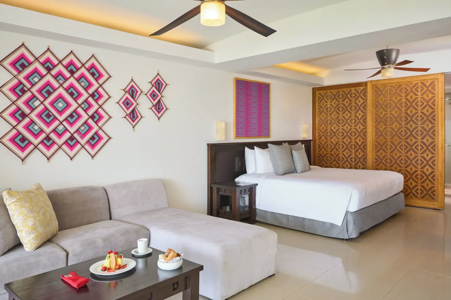 King bed guest room with sofa at Fiesta Americana Riviera Nayarit Resort & Spa.