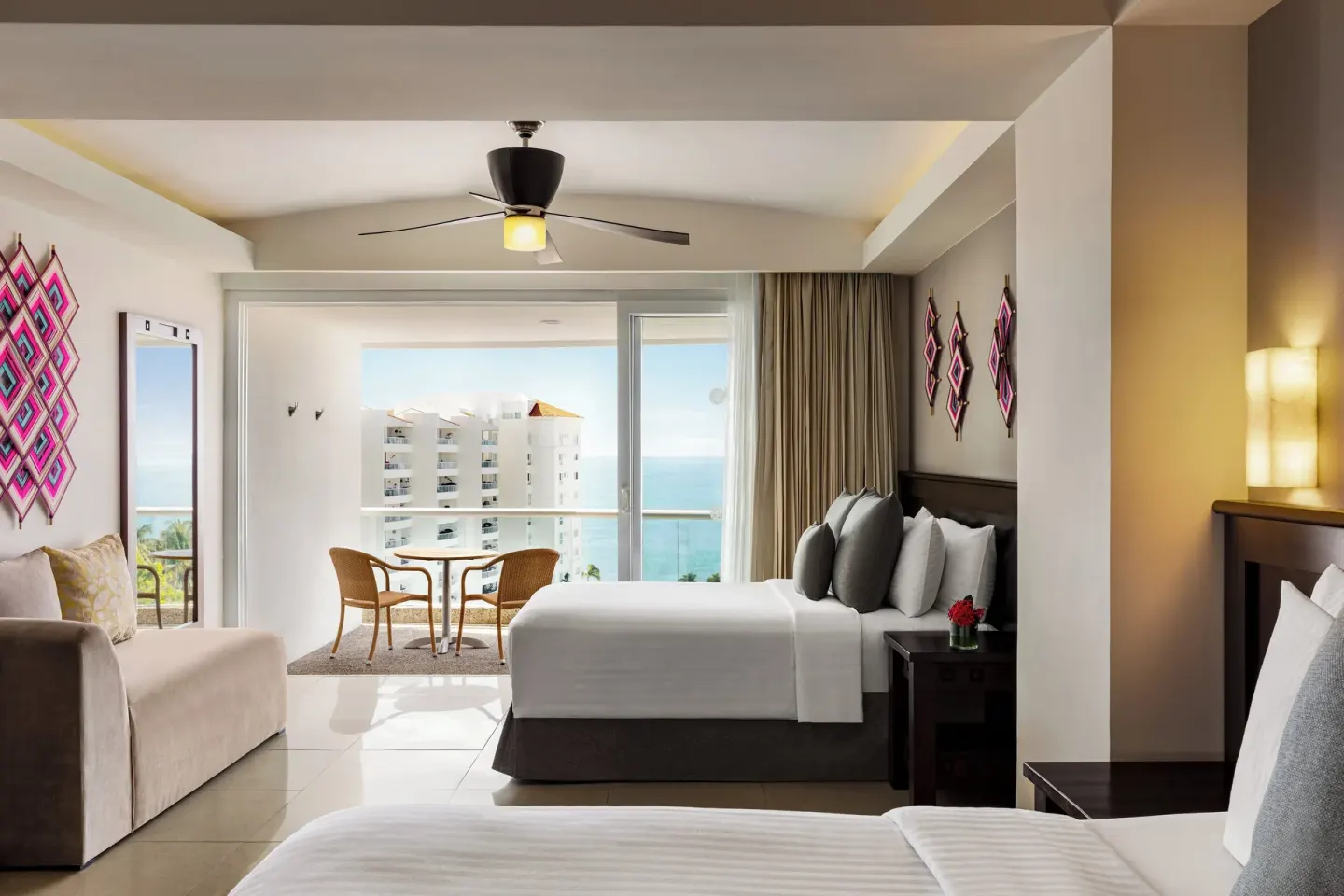 Two-bed guest room with balcony and ocean view at Fiesta Americana Riviera Nayarit Resort & Spa.