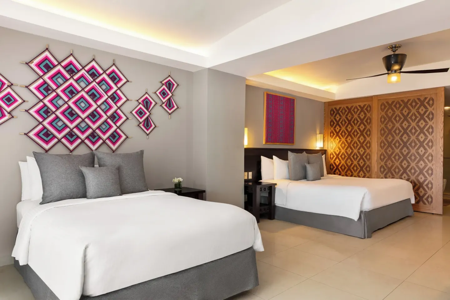 Two-bed guest room with patterned divider at Fiesta Americana Riviera Nayarit Resort & Spa.