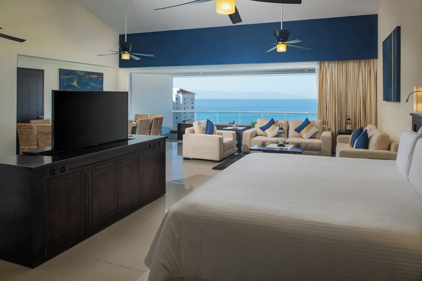 Ocean-view suite with king bed and lounge at Fiesta Americana Riviera Nayarit Resort & Spa.