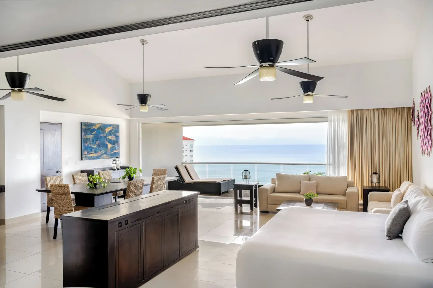Spacious ocean-view suite with king bed at Fiesta Americana Riviera Nayarit Resort & Spa.