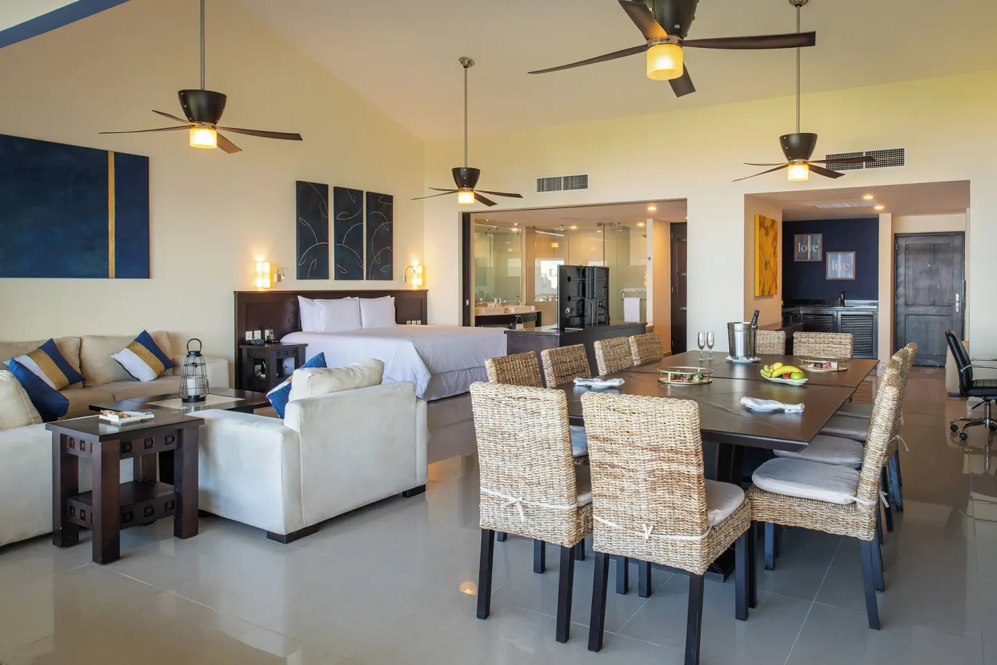 Spacious suite with king bed and dining area at Fiesta Americana Riviera Nayarit Resort & Spa.