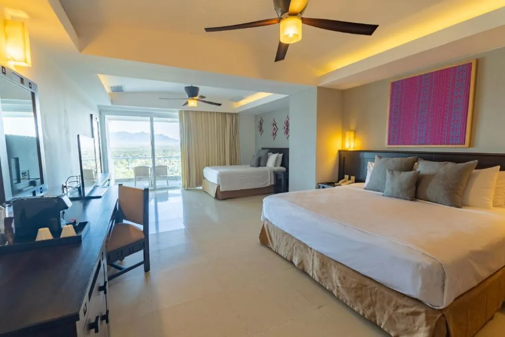 Family Junior Suite with two beds and balcony at Fiesta Americana Riviera Nayarit Resort & Spa.